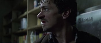 Movie still from “Identity” (2003), directed by James Mangold – A person wearing a neck tie; Close Up shot, Low angle