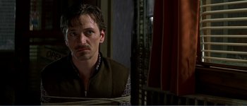 Movie still from “Identity” (2003), directed by James Mangold – A person with a rope around their neck; Close Up shot, Over the shoulder angle