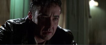 Movie still from “Identity” (2003), directed by James Mangold – A person with wet hair; Close Up shot, Low angle