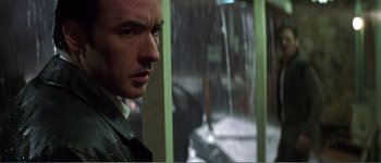 Movie still from “Identity” (2003), directed by James Mangold – A person looking out of a window; Close Up shot, Low angle