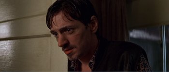 Movie still from “Identity” (2003), directed by James Mangold – A person with wet hair; Close Up shot, Low angle