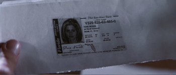 Movie still from “Identity” (2003), directed by James Mangold – An id is shown on top of a piece of paper; Extreme Close Up shot, High angle