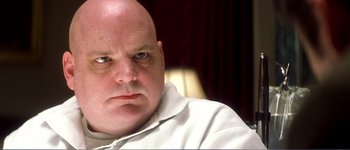 Movie still from “Identity” (2003), directed by James Mangold – A man with a bald head is looking at the camera; Close Up shot, Low angle