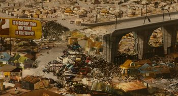 Movie still from “Idiocracy” (2006), directed by Mike Judge – An aerial view of a pile of trash and rubble; Extreme Wide shot, High angle