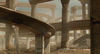 Movie still from “Idiocracy” (2006), directed by Mike Judge – An overpass is shown in the middle of a destroyed city; Extreme Wide shot, High angle