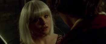 Movie still from “If I Stay” (2014), directed by R.J. Cutler – A woman with white hair looking into a mirror; Close Up shot, Over the shoulder angle