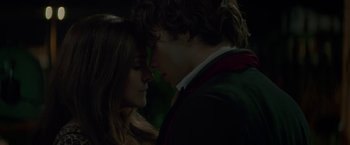 Movie still from “If I Stay” (2014), directed by R.J. Cutler – A man and a woman are looking into each others eyes; Close Up shot, Overhead angle