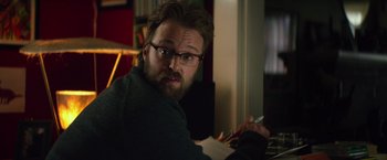 Movie still from “If I Stay” (2014), directed by R.J. Cutler – A man with a beard is sitting at a table; Close Up shot, Over the shoulder angle