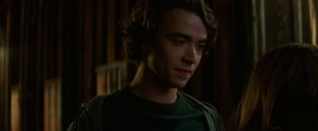 Movie still from “If I Stay” (2014), directed by R.J. Cutler – A person wearing a green shirt; Close Up shot, Over the shoulder angle