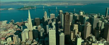 Movie still from “If I Stay” (2014), directed by R.J. Cutler – An aerial view of a city with a bridge in the background; Extreme Wide shot, High angle
