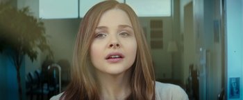 Movie still from “If I Stay” (2014), directed by R.J. Cutler – A person with long hair; Close Up shot, Low angle