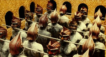 Movie still from “Immortals” (2011), directed by Tarsem Singh – A group of statues that look like people; Extreme Wide shot, High angle