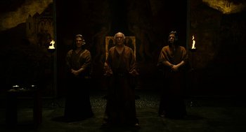 Movie still from “Immortals” (2011), directed by Tarsem Singh – A group of men standing next to each other in robes; Wide shot, High angle