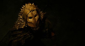 Movie still from “Immortals” (2011), directed by Tarsem Singh – A person wearing a mask with spikes on it; Close Up shot, High angle