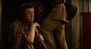 Movie still from “Immortals” (2011), directed by Tarsem Singh – An older man sitting in front of another man; Close Up shot, Over the shoulder angle