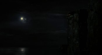 Movie still from “Immortals” (2011), directed by Tarsem Singh – A full moon is setting over a dark night sky; Extreme Wide shot, Low angle