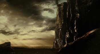 Movie still from “Immortals” (2011), directed by Tarsem Singh – A large rock formation in the middle of the night; Extreme Wide shot, Low angle