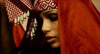 Movie still from “Immortals” (2011), directed by Tarsem Singh – A person wearing a headdress; Close Up shot, High angle