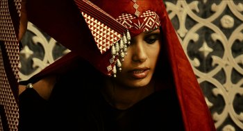 Movie still from “Immortals” (2011), directed by Tarsem Singh – A woman with a red headscarf on her head; Close Up shot, Low angle