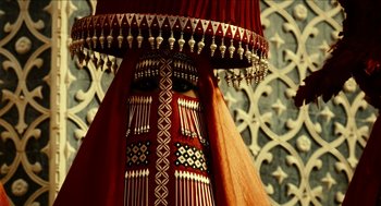Movie still from “Immortals” (2011), directed by Tarsem Singh – View of a red and gold lampshade; Close Up shot, Overhead angle