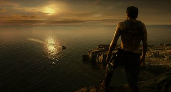Movie still from “Immortals” (2011), directed by Tarsem Singh – A man standing on top of a cliff looking out over the ocean; Extreme Wide shot, High angle