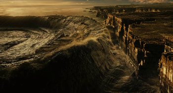 Movie still from “Immortals” (2011), directed by Tarsem Singh – An image of an ocean with a cliff in the background; Extreme Wide shot, High angle