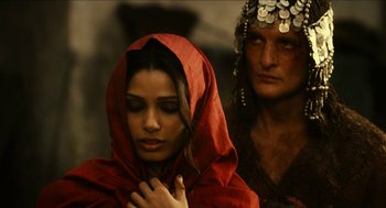Movie still from “Immortals” (2011), directed by Tarsem Singh – A man and a woman in a red cloak; Close Up shot, Over the shoulder angle