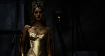 Movie still from “Immortals” (2011), directed by Tarsem Singh – A woman wearing a gold dress and a crown; Medium shot, Low angle