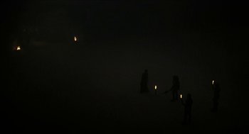 Movie still from “Immortals” (2011), directed by Tarsem Singh – A group of people standing in the middle of the night; Extreme Wide shot, High angle