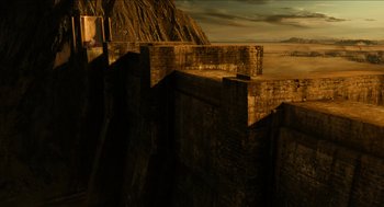 Movie still from “Immortals” (2011), directed by Tarsem Singh – A view of a mountain and a river from the top of a bridge; Extreme Wide shot, High angle