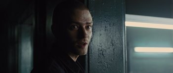 Movie still from “In Time” (2011), directed by Andrew Niccol – A person looking at the camera; Close Up shot, Over the shoulder angle