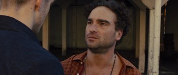 Movie still from “In Time” (2011), directed by Andrew Niccol – A person wearing a shirt; Close Up shot, Over the shoulder angle