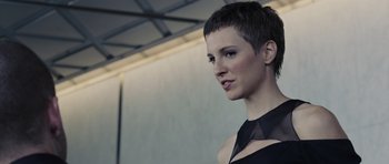 Movie still from “In Time” (2011), directed by Andrew Niccol – A person with short black hair; Close Up shot, Low angle