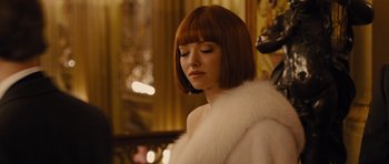 Movie still from “In Time” (2011), directed by Andrew Niccol – A woman in a white fur coat with her eyes closed; Close Up shot, Low angle
