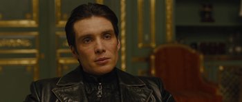 Movie still from “In Time” (2011), directed by Andrew Niccol – A person wearing a leather jacket; Close Up shot, Low angle