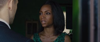 Movie still from “In Time” (2011), directed by Andrew Niccol – A person with long black hair; Close Up shot, Over the shoulder angle