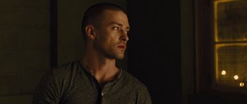 Movie still from “In Time” (2011), directed by Andrew Niccol – A person wearing a black shirt; Close Up shot, Low angle