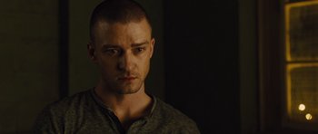 Movie still from “In Time” (2011), directed by Andrew Niccol – A person wearing a shirt; Close Up shot, Over the shoulder angle