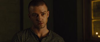 Movie still from “In Time” (2011), directed by Andrew Niccol – A person wearing a shirt; Close Up shot, Over the shoulder angle
