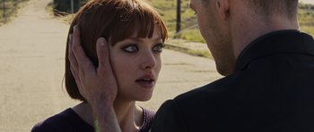Movie still from “In Time” (2011), directed by Andrew Niccol – A man touching the ear of a beautiful woman; Close Up shot, Over the shoulder angle