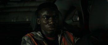 Movie still from “Imperium” (2016), directed by Daniel Ragussis – A person sitting in a car; Close Up shot, High angle