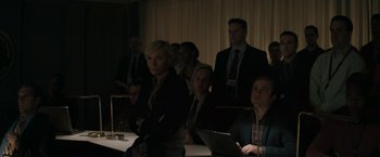 Movie still from “Imperium” (2016), directed by Daniel Ragussis – A group of people sitting at a table with laptops; Medium shot, High angle