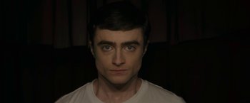 Movie still from “Imperium” (2016), directed by Daniel Ragussis – A person wearing a white t - shirt; Close Up shot, High angle