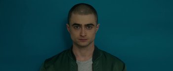 Movie still from “Imperium” (2016), directed by Daniel Ragussis – A person wearing a green jacket; Close Up shot, Overhead angle
