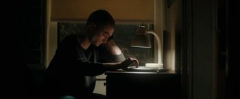 Movie still from “Imperium” (2016), directed by Daniel Ragussis – A man sitting in front of a computer desk; Medium shot, High angle