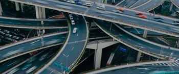 Movie still from “Imperium” (2016), directed by Daniel Ragussis – An aerial view of cars driving on a freeway; Extreme Wide shot, High angle