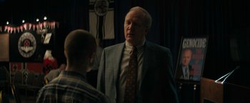 Movie still from “Imperium” (2016), directed by Daniel Ragussis – An older man wearing a suit talking to a young man; Medium shot, Over the shoulder angle