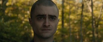 Movie still from “Imperium” (2016), directed by Daniel Ragussis – A person with a bald head; Close Up shot, Over the shoulder angle