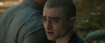 Movie still from “Imperium” (2016), directed by Daniel Ragussis – A person with a shaved head; Close Up shot, Over the shoulder angle