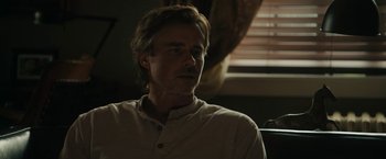 Movie still from “Imperium” (2016), directed by Daniel Ragussis – A person sitting in a room; Close Up shot, Low angle
